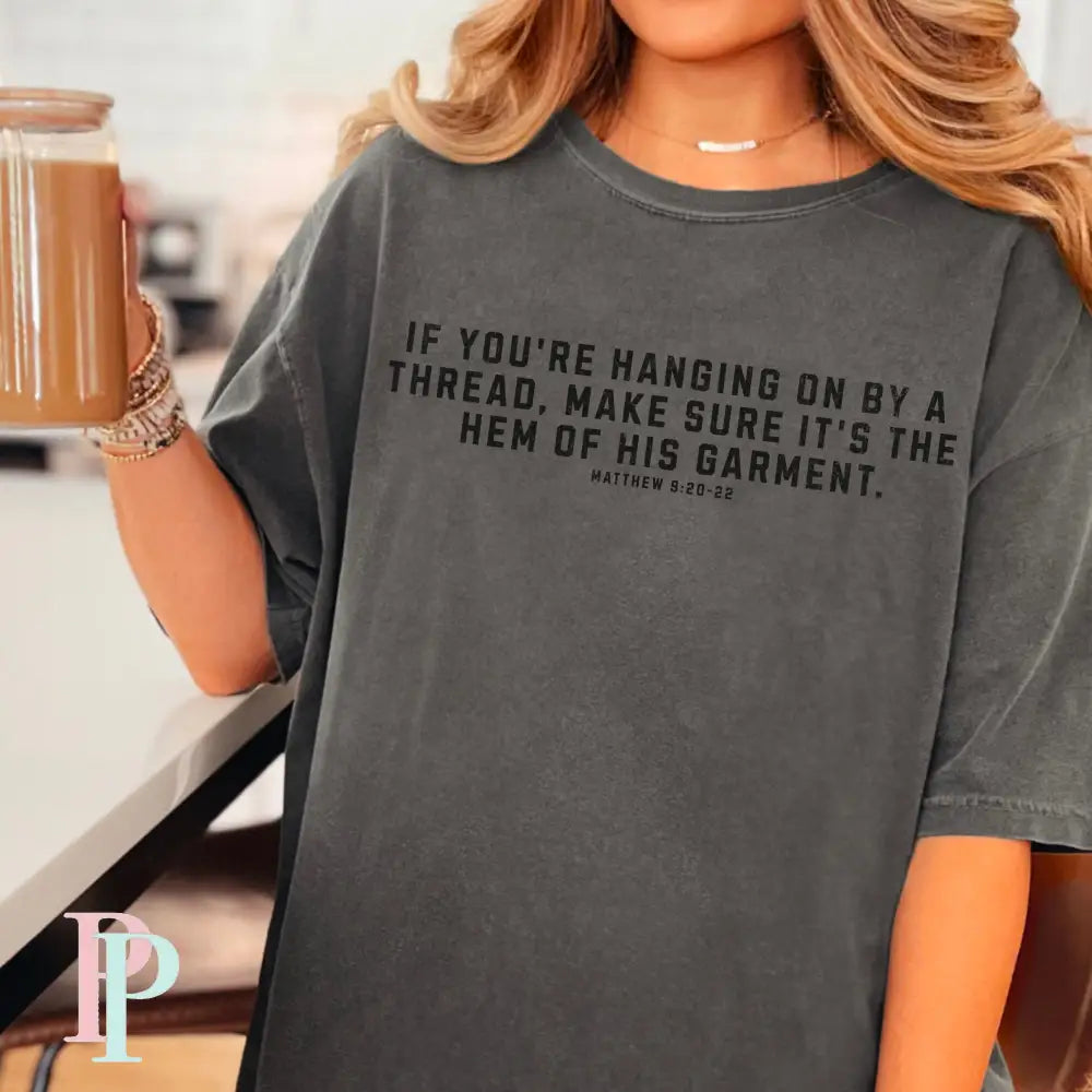 If You’re Hanging On By A Thread make Sure It’s The Hem Of His Garment Comfort Color Graphic Tee SMALL / PEPPER