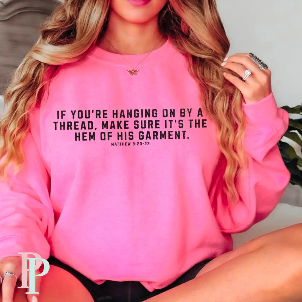 If You’re Hanging On By A Thread Make Sure It’s The Hem Of His Garment Crewneck Sweatshirt Neon Pink / Small