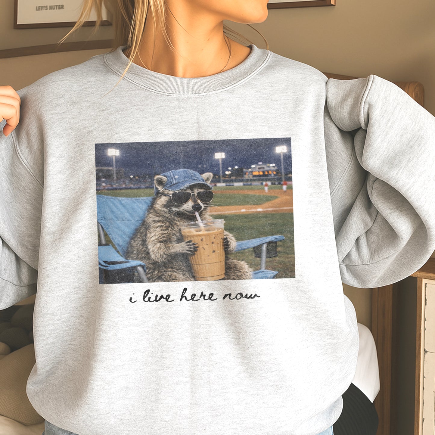I Live Here Now Raccoon Baseball Crewneck Sweatshirt