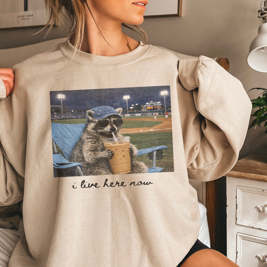 I Live Here Now Raccoon Baseball Crewneck Sweatshirt
