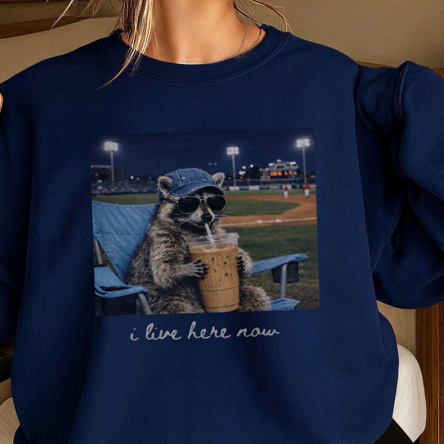 I Live Here Now Raccoon Baseball Crewneck Sweatshirt