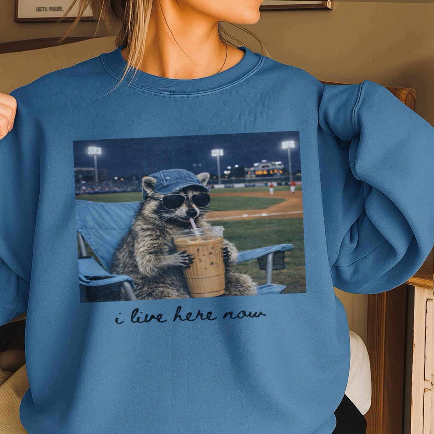 I Live Here Now Raccoon Baseball Crewneck Sweatshirt