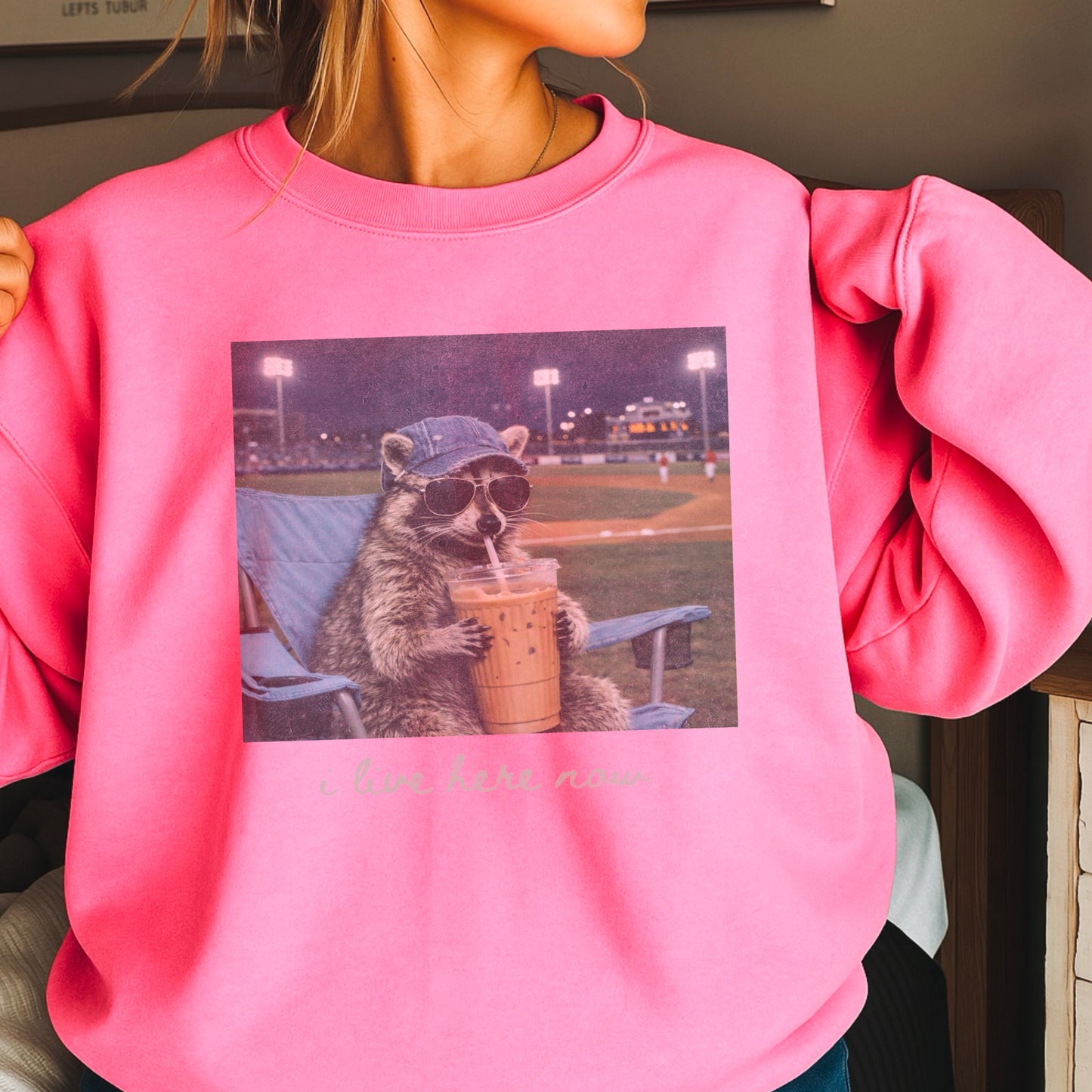 I Live Here Now Raccoon Baseball Crewneck Sweatshirt