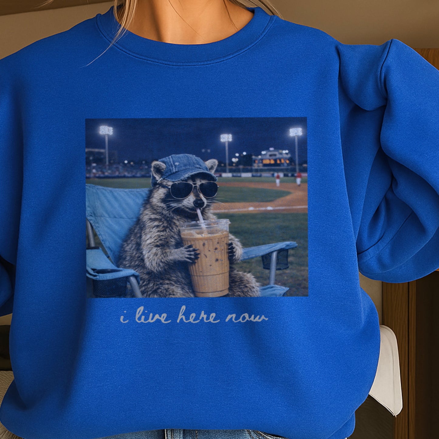 I Live Here Now Raccoon Baseball Crewneck Sweatshirt