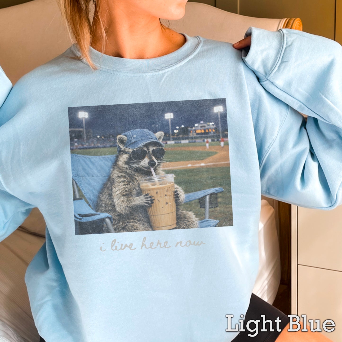 I Live Here Now Raccoon Baseball Crewneck Sweatshirt