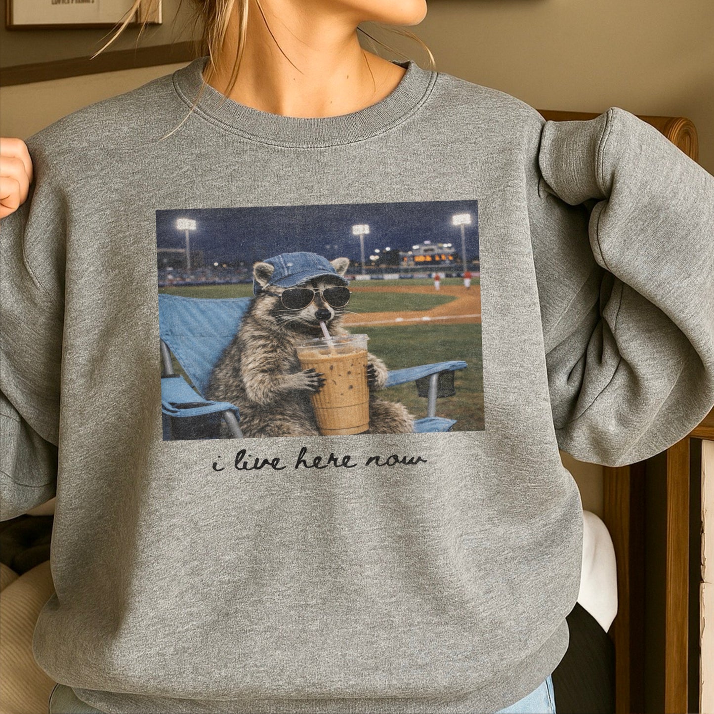 I Live Here Now Raccoon Baseball Crewneck Sweatshirt