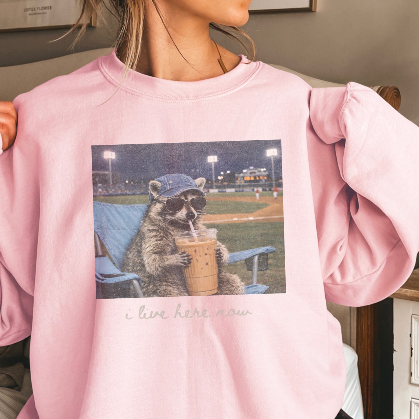 I Live Here Now Raccoon Baseball Crewneck Sweatshirt