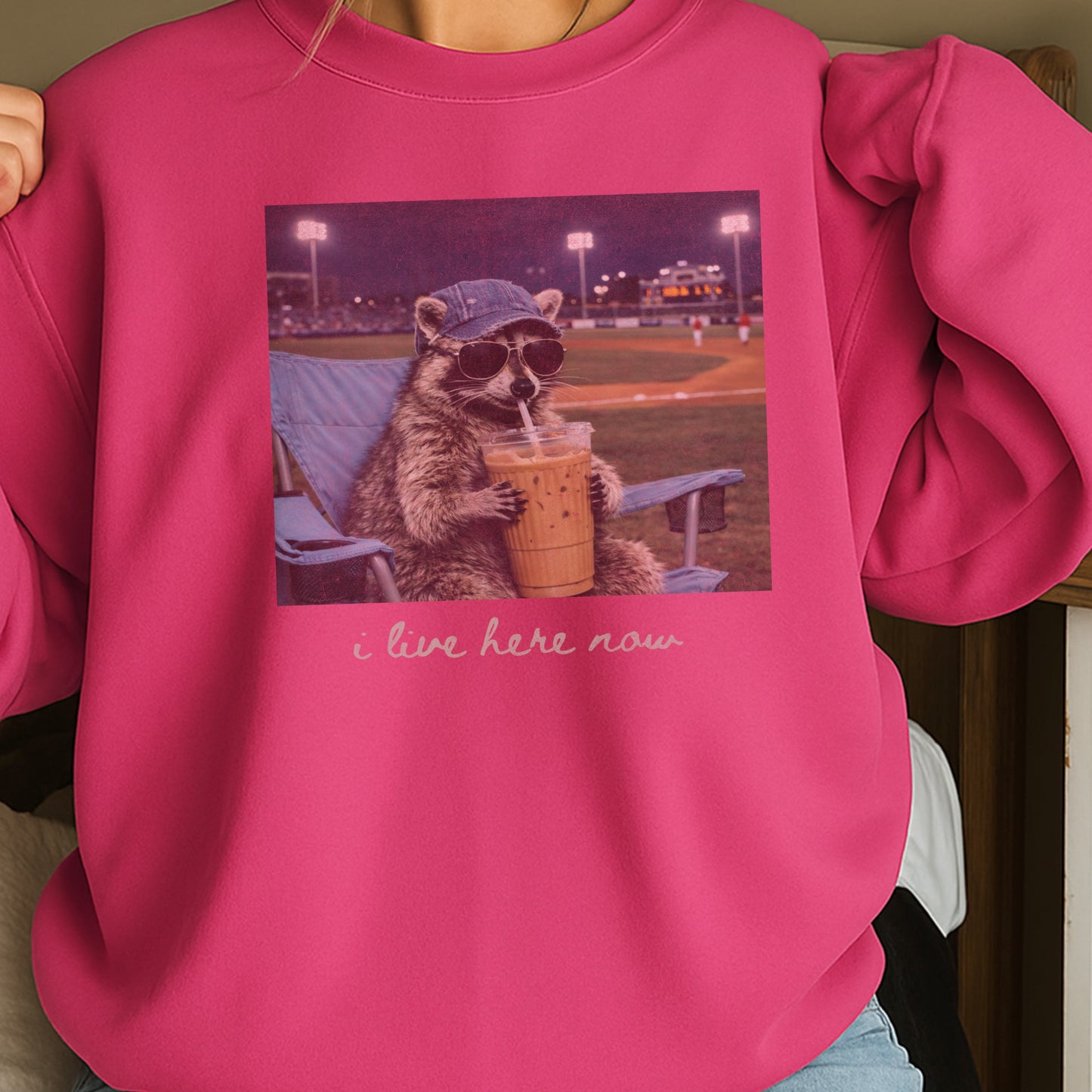 I Live Here Now Raccoon Baseball Crewneck Sweatshirt