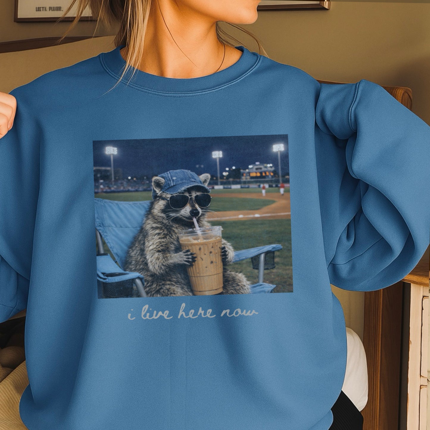 I Live Here Now Raccoon Baseball Crewneck Sweatshirt