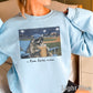 I Live Here Now Raccoon Baseball Crewneck Sweatshirt