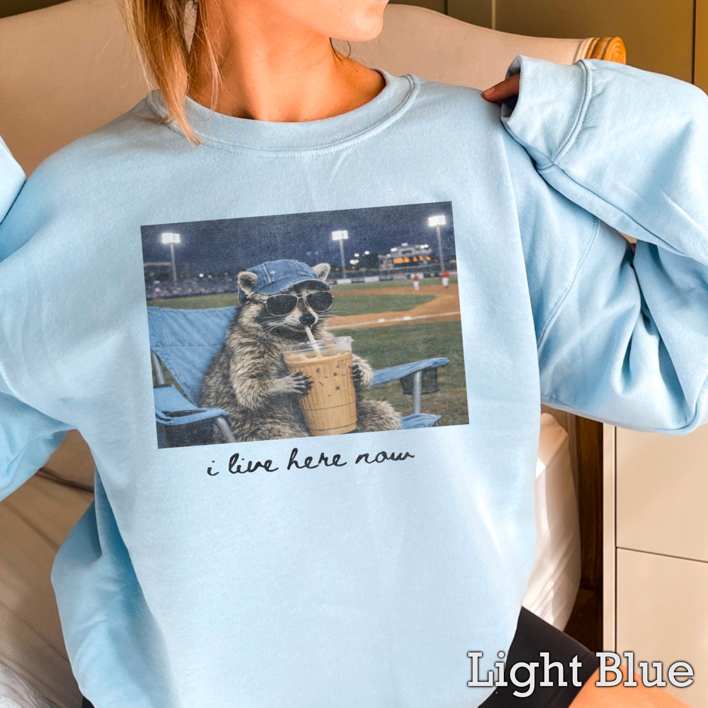 I Live Here Now Raccoon Baseball Crewneck Sweatshirt