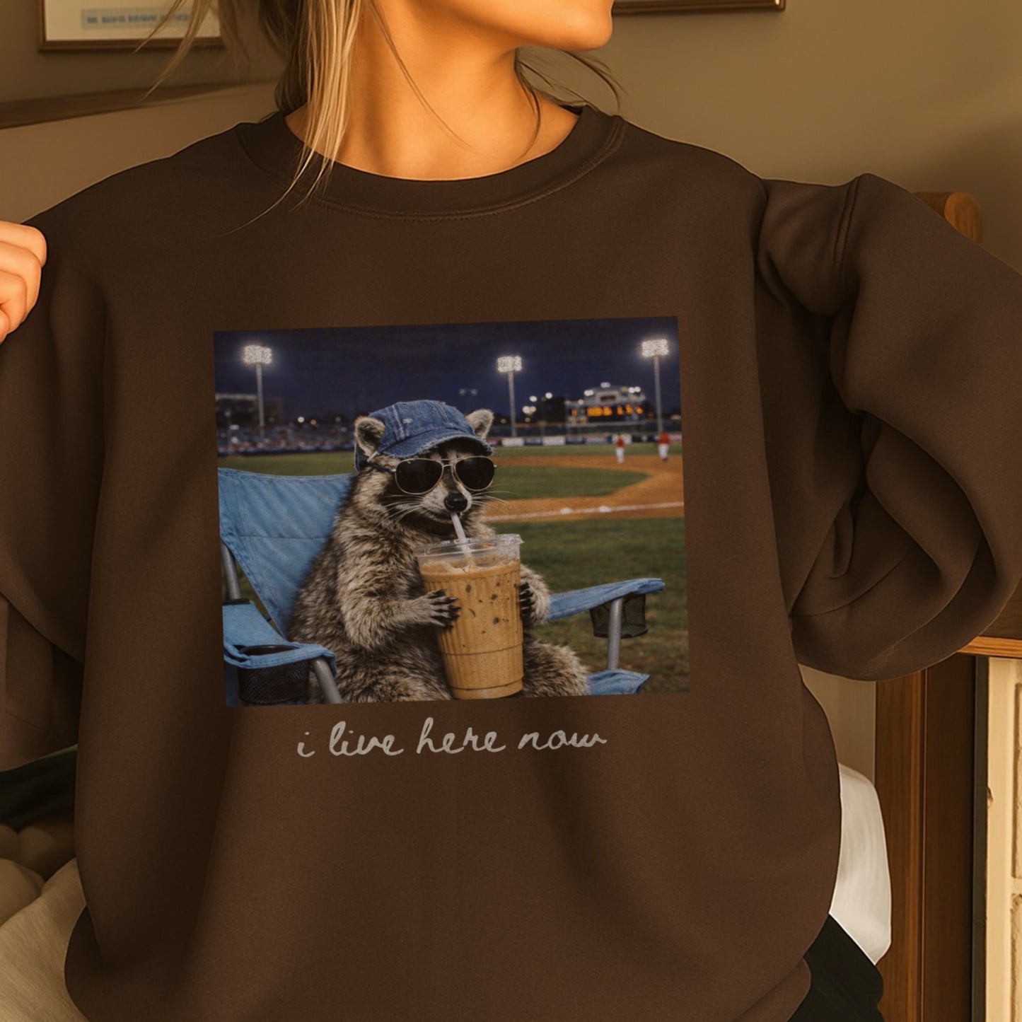 I Live Here Now Raccoon Baseball Crewneck Sweatshirt