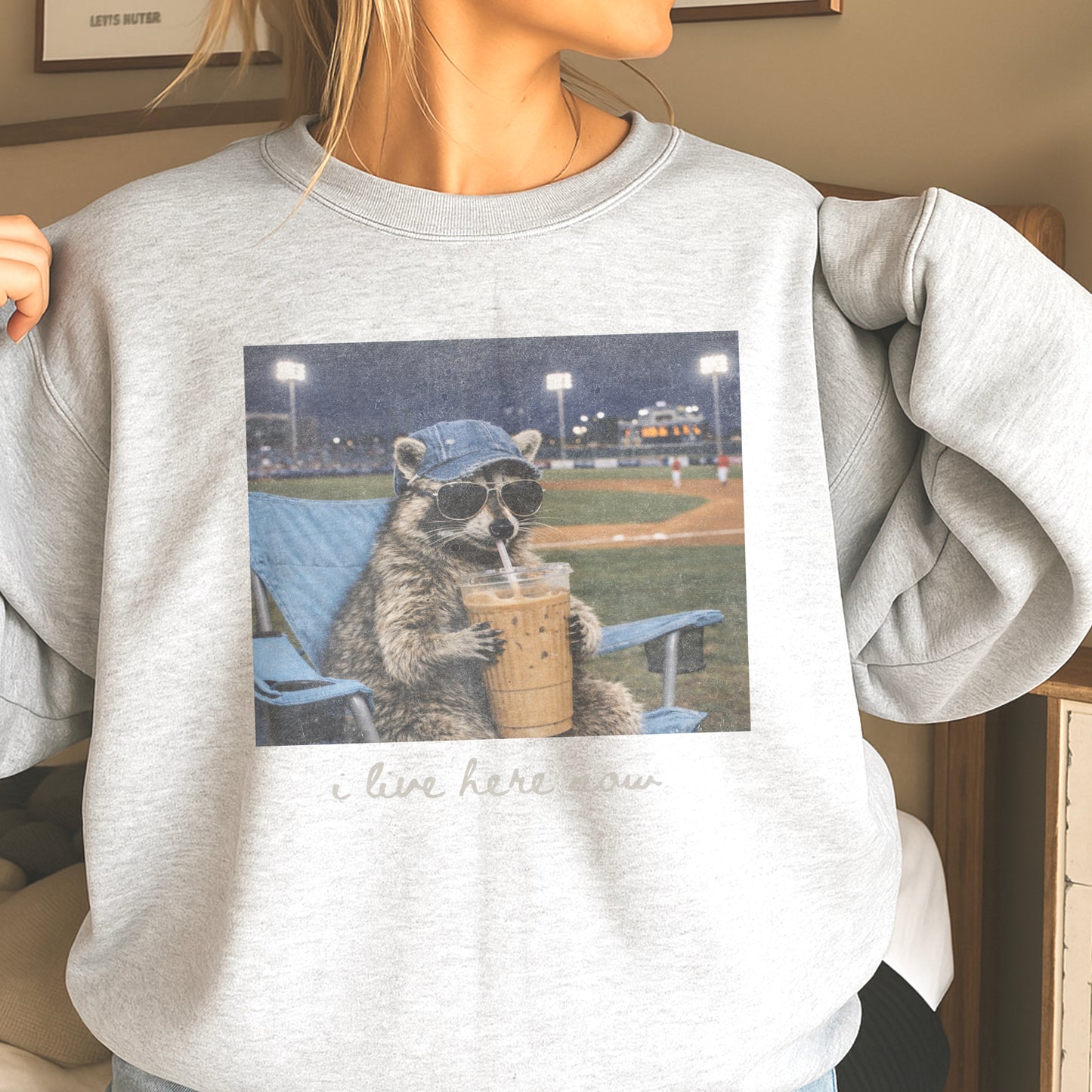 I Live Here Now Raccoon Baseball Crewneck Sweatshirt