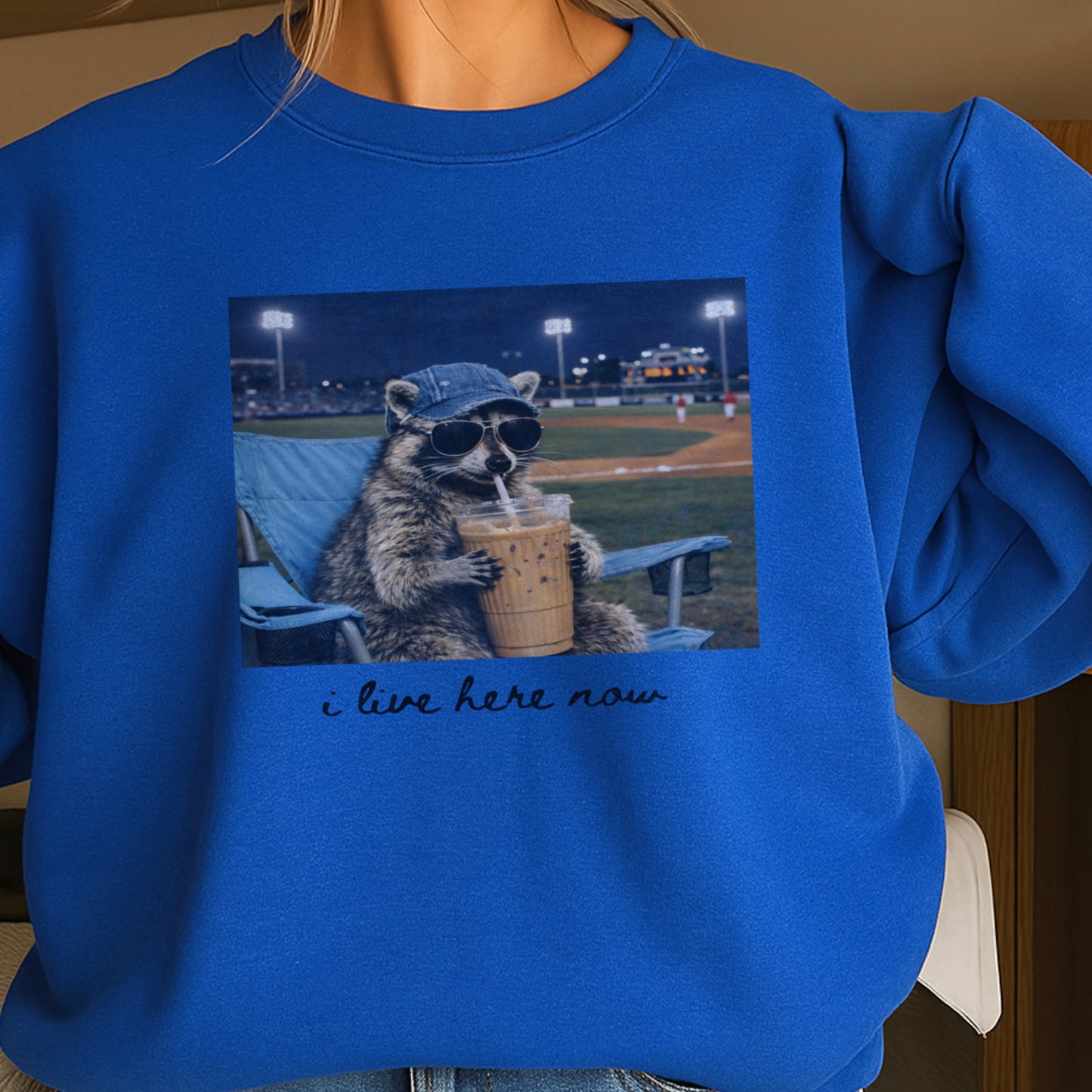 I Live Here Now Raccoon Baseball Crewneck Sweatshirt