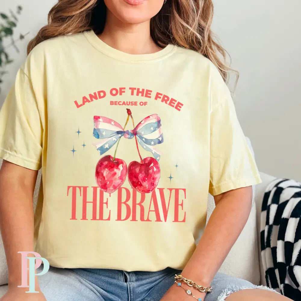 Land Of The Free Because Of The Brave Comfort Color Graphic Tee SMALL / BANANA